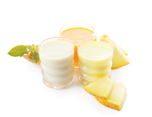 Glasses of tasty melon milkshake on white background