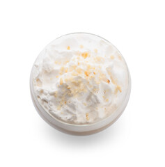 Glass of tasty latte with nuts on white background