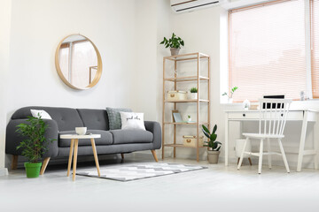 Interior of modern living room with sofa, table and shelf unit