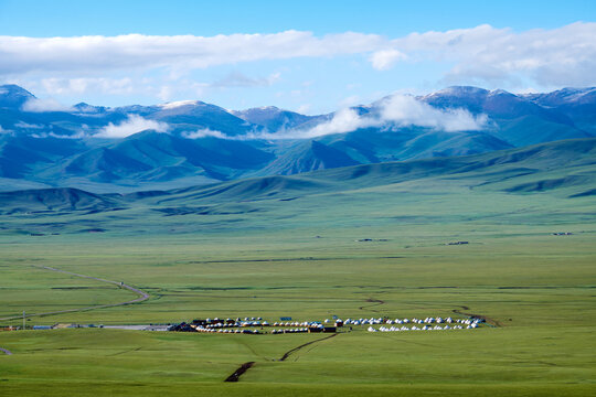 The Mountains And Mongolian Yurts In Bayanbulak Grassland Scenic Spot Xinjiang Uygur Autonomous Region
