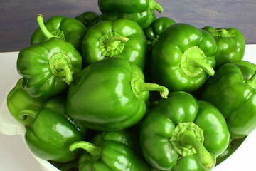 fresh green Pepper or bell pepper in basket closeup