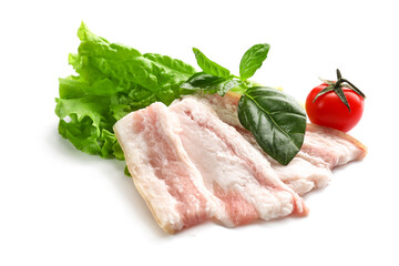 Slices of uncooked bacon with greens on white background