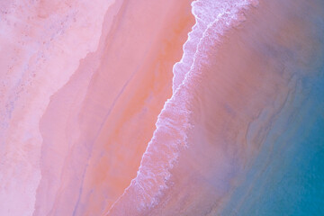 Top view of amazing pastel pink sand beach and turquoise sea copy space available nature background...