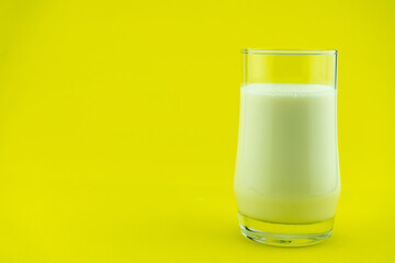 Banner of a glass of milk on colorful background Milk day Copy space