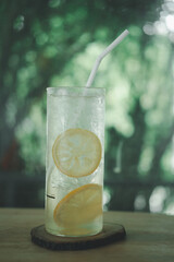 Iced honey mix lemon decoration with slice lemon in glass on the table