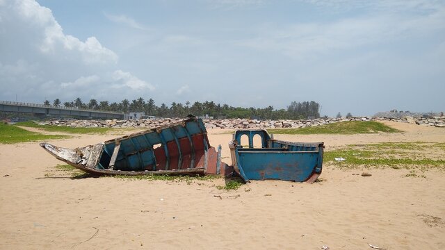 Wrecked fishing boats on the beach, perumathura beach, Thiruvananthapuram, Kerala, seascape view