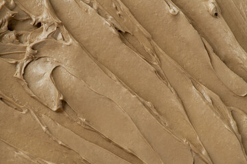 Fototapeta na wymiar Brown frosting texture background close-up
