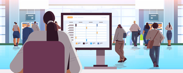 businesswoman using agenda on computer monitor time management organization at work concept office interior