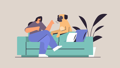 young woman spending time with dog female owner and cute domestic animal friendship with pet concept