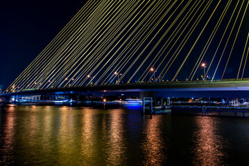 Bangkok, thailand - Nov 23, 2019 : The Rama VIII Bridge is a cable-stayed bridge crossing the Chao Phraya River at night in Bangkok, Thailand