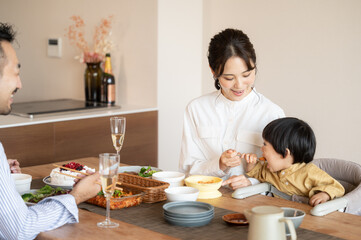 Obraz na płótnie Canvas Happy Family Table Asian couple and their baby