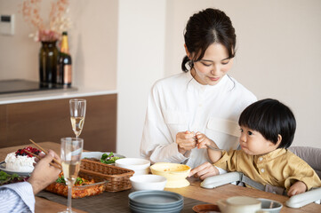 Obraz na płótnie Canvas An Asian (Japanese) baby eating his birthday meal with his mom.