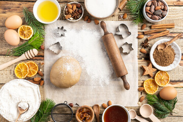 Ingredients for cooking Christmas baking and gingerbread cookies on a wooden background, topview. New Year, holidays, holidays.
