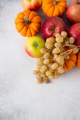 Vegetables and fruits on a table. Healthy food, autumn harvest. Copy space.