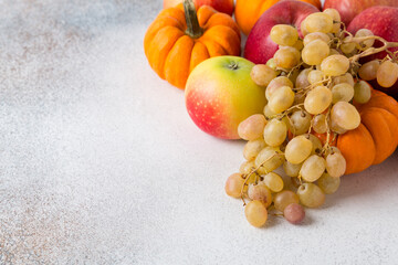 Vegetables and fruits on a table. Healthy food, autumn harvest. Copy space.