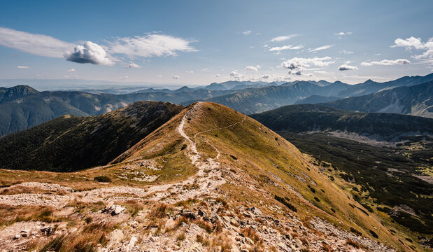 Hiking to salatin and brestova peak from zuberec. Western Tatras mountains, Rohace Slovakia. Hiker with backpack rises to the mountains. Slovakia mountains landscape.