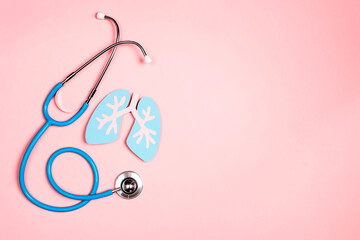Prevention of pulmonary disease. Lung symbol and stethoscope on a pink background.