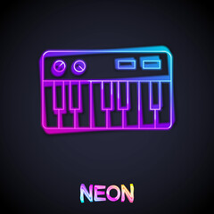 Fototapeta premium Glowing neon line Music synthesizer icon isolated on black background. Electronic piano. Vector
