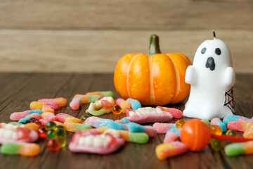 Obraz na płótnie Canvas Happy Halloween day with ghost candies, candle, pumpkin, Jack O lantern and decorative (selective focus). Trick or Threat, Hello October, fall autumn, Festive, party and holiday concept