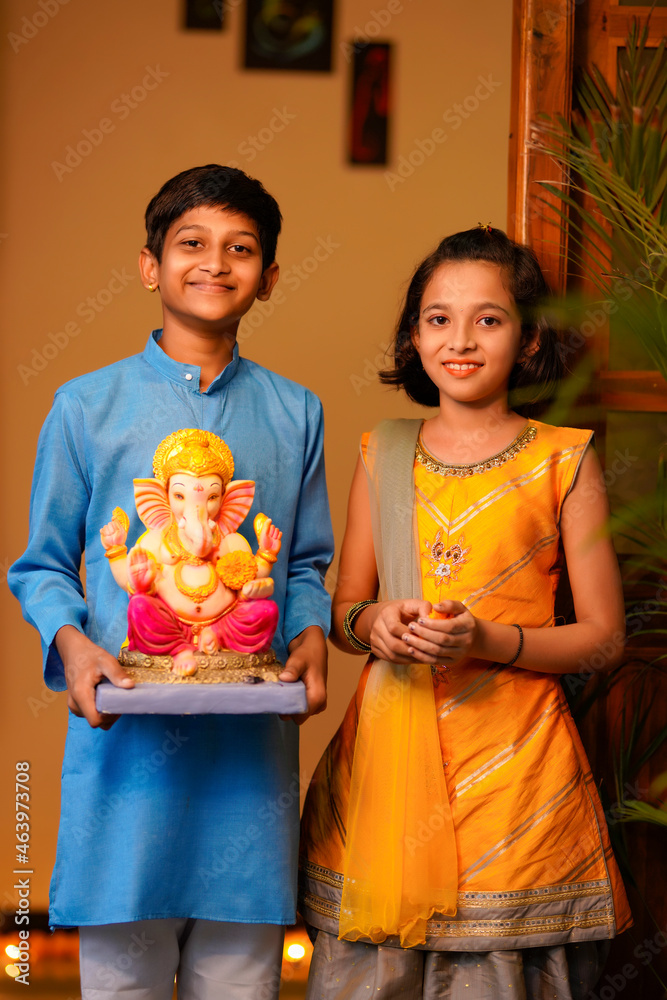 Poster Little indian siblings with lord ganesha.