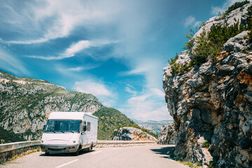 White colour Caravan motorhome car on background of mountain nature landscape - obrazy, fototapety, plakaty