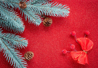 Christmas and New Year holidays background. Christmas decorations on the red background, flat lay. Space for text