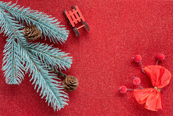 Christmas and New Year holidays background. Christmas decorations on the red background, flat lay. Space for text