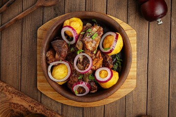 Georgian national dish ojahuri with meat on wooden background