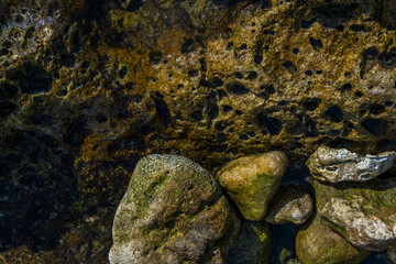 Background image of rocks on the Mediterranean coast of the island of Mallorca. Abstract textures