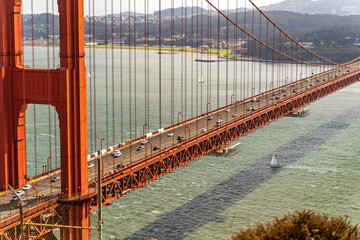 Cars drive over Golden Gate Bridge In San Francisco