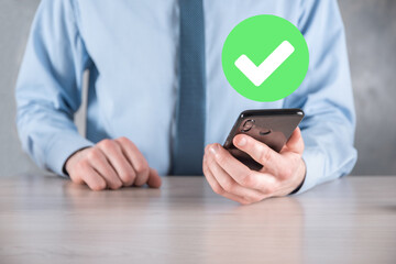 Hand holds green icon Check mark,Check Mark Sign, Tick Icon,right sign,circle green checkmark...