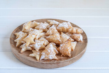 Puff Pastry Christmas Cookies over wooden background.