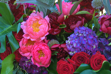 Floral decorations. A flowers bouquet made from red poppies, roses and other spring plants. 