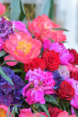 Floral decorations. A flowers bouquet made from red poppies, roses and other spring plants. 