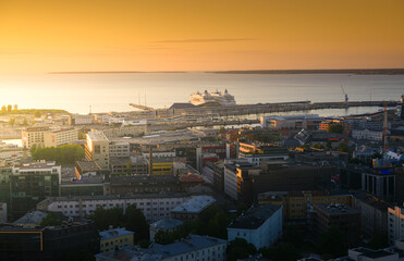 Amazing sunrise over Tallinn, Estonia, during a beautiful summer day with orange sky. Capitals of Europe.