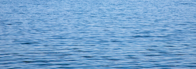 Obraz premium texture of surface of blue water - sea background