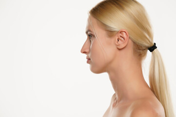 Profile of a young blond woman without makeup