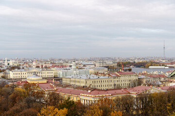 Fototapeta premium Panorama of St. Petersburg from the background height. View of the rooftops of St. Petersburg in autumn. Points of interest and city center