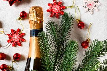 New Year composition with golden champagne bottle and christmas decor. New Year Flatly. Christmas flatlay. New year 2022. New year concept