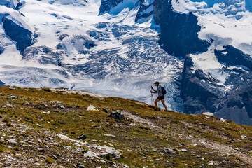 Fototapeta premium Hiking in the Swiss Alps with snowy mountains in the background Zermatt Matterhorn Switzerland