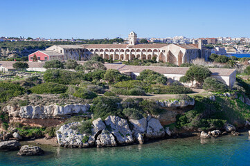 Fototapeta na wymiar L'Illa del Rei Hospital Island in the middle of the main navigable entry channel to Mahon in Menorca in the Mediterranean Sea