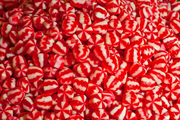 Texture of red and white jelly candies. Sweets on a pile close up. Sweets shop window.