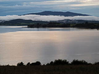 Fog over the lakeafter the storm, lake Lipno in the mountains Sumava, Czech Republic