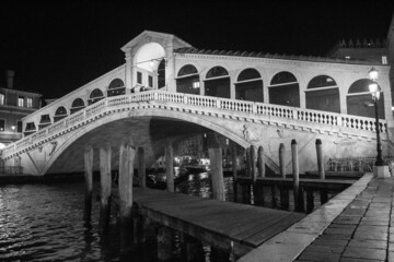 Venice, Italy, January 28, 2020 evocative black and white image of the Rialto Bridge by night, one of the most 
famous symbols of the city