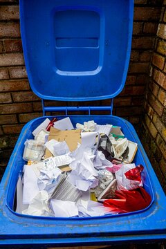 Paper packaging in open recycling bin