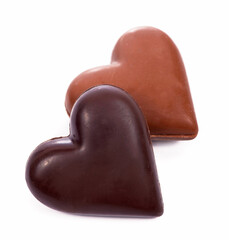 Coffee beans heart with heart-shaped candy on white background