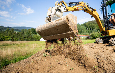 Mini Excavator bucket closeup during work on construction site