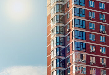 Fototapeta premium Fragment of one of the serial high-rise apartment buildings in city suburbs.