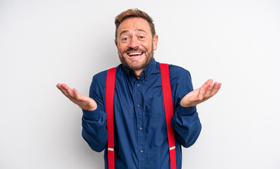 middle age handsome man feeling happy and astonished at something unbelievable