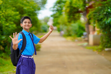 indian little boy asking for lift going to school - obrazy, fototapety, plakaty